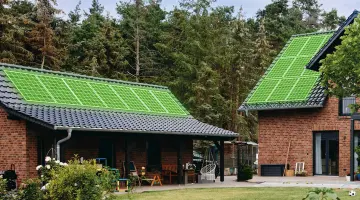 Ein Haus mit Photovoltaikanlage aus grünen Linien auf dem Dach